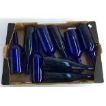 A box of nine Bristol blue glass bottles