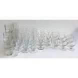 A large collection of glasses, to include 12 conical flutes, various wine glasses, water glasses etc