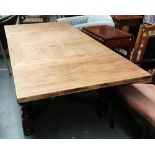 A substantial oak draw leaf table, the top recently refinished to a light oak, on substantial cup