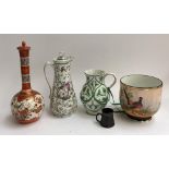 A mixed lot of ceramics to include a Bideford pottery jug; 19th century lidded jug decorated with