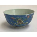 A Chinese bowl, decorated with images of gourds, fans, flutes and swords, four character Qianlong