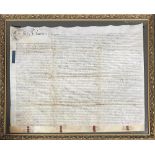 A framed property deed on vellum, bearing wax seals, approx. 75x93cm