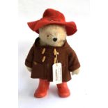 A Paddington bear teddy with coat, hat and boots