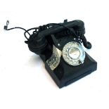 A vintage rotary dial telephone, label reading Yeovil