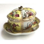 A quatrefoil shaped lidded pot and dish, decorated with encrusted floral handle, continental