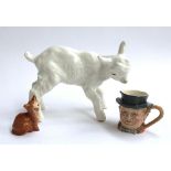 A large pottery lamb figurine marked USSR 24cm long 18cm high; together with a Beswick cat and