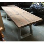 A modern kitchen bench, substantial two plank top on two steel U shaped supports, 150x43x44cmH