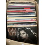 A mixed box of vinyl LPs, mostly rock and pop, Diana Ross, The Shadows, Now, Rick Astley, Toto etc