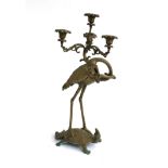 A 20th century Japanese three branch candelabra, in the form of a tortoise carrying a crane on its