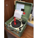 A Trixette portable electric gramophone, with Garrard turntable