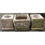 A pair of square composite stone planters, 27cmH, together with one other
