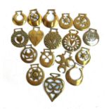 A collection of 17 mainly 19th century horse brasses, crescent and heart motifs