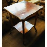 A 19th century shaped occasional table, with undershelf, on casters, 51x51x66cmH