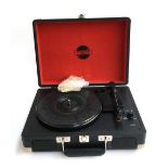 A portable Zenox three speed record player, with built in speakers