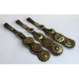 Three sets of mounted leather horse brasses