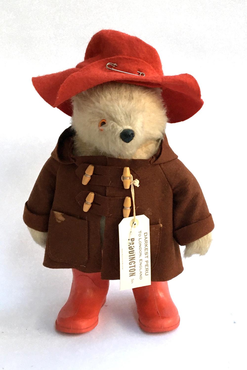 A Paddington bear teddy with coat, hat and boots