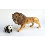 A Beswick lion, 14cmH; together with a Beswick panda, 5.5cmH