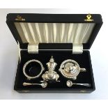An Irish silver plated cased cruet set, comprising salt, mustard, pepper, and spoons; together