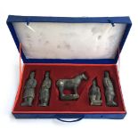 A boxed set of five miniature terracotta army statues