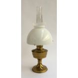 A brass 'Aladdin' oil lamp with milk glass shade and chimney