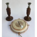 A pair of turned oak candlesticks, each 27cmH; together with a vintage Metamec wall clock