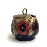A Moorcroft pansy design jam pot, 7cmH, with silver plated lid