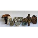 A mixed lot of studio pottery to include two sets of six goblets, several salad bowls, swan