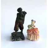 A Royal Doulton figurine, 'Sissy', 13cmH; together with a resin figure of a golfer on a marble