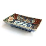 A Chinese rectangular dish, decorated with flora and fauna, heightened in gilt, 11.5x19.5cm