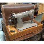 A Singer sewing machine in carry case