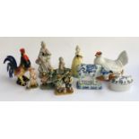 A mixed lot of ceramic figures, to include a Delft cow, studio pottery cockerel, chicken tureen etc