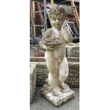 A garden statue of cherub with fruit, 70cmH