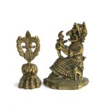 A Punch & Judy 'Judy' brass doorstop, together with one other in the form of a pad foot