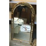 A Venetian style domed top mirror, 110x61cm