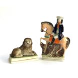 A Staffordshire figure of 'Tom King', 20cmH together with a Staffordshire figure of a recumbent