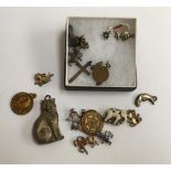 Selection of charms and pendants to include two featuring the Lords Prayer, one commemorating Robert