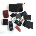 A bag of unused leather wallets etc, to include a Harrods notebook and an Eximious London wallet,