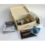 A linen box containing Scanmagic DVD player and instructions, foreign currency converters, Art