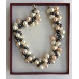 A freshwater cultured pearl necklace with 925 silver chain and clasp in display box