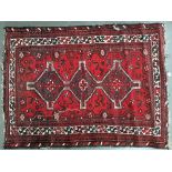 A small West Persian rug, 150x110cm; together with a pair of saddlebags and one other very small