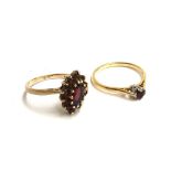 9ct gold dress ring set with one central oval garnet surrounded by tiny garnets, size Q, gross