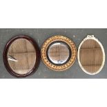 A gilt and gesso circular convex mirror with bobble moulding, 49cmD; together with two others (3)