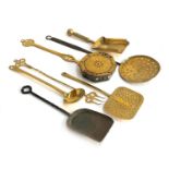 A collection of 18th century and later fire tools and related implements, includes chestnut roaster