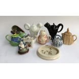 A mixed lot of ceramics, mainly novelty teapots, to include Wade; together with Johnson Burslem '