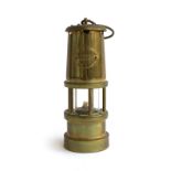 A brass miners lamp by Hockley Lamp & Limelight Co.