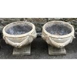 A pair of composite stone urns, 34cmH