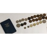 A quantity of British coins, including three maundy threepence pieces (1919 and 1922), four £1