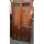 A Victorian mahogany glazed bookshelf, over cupboard, two doors with applied mouldings, 114x36.