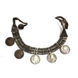 A white metal Laotian necklace, made with five Indian rupees, c.1900-1919