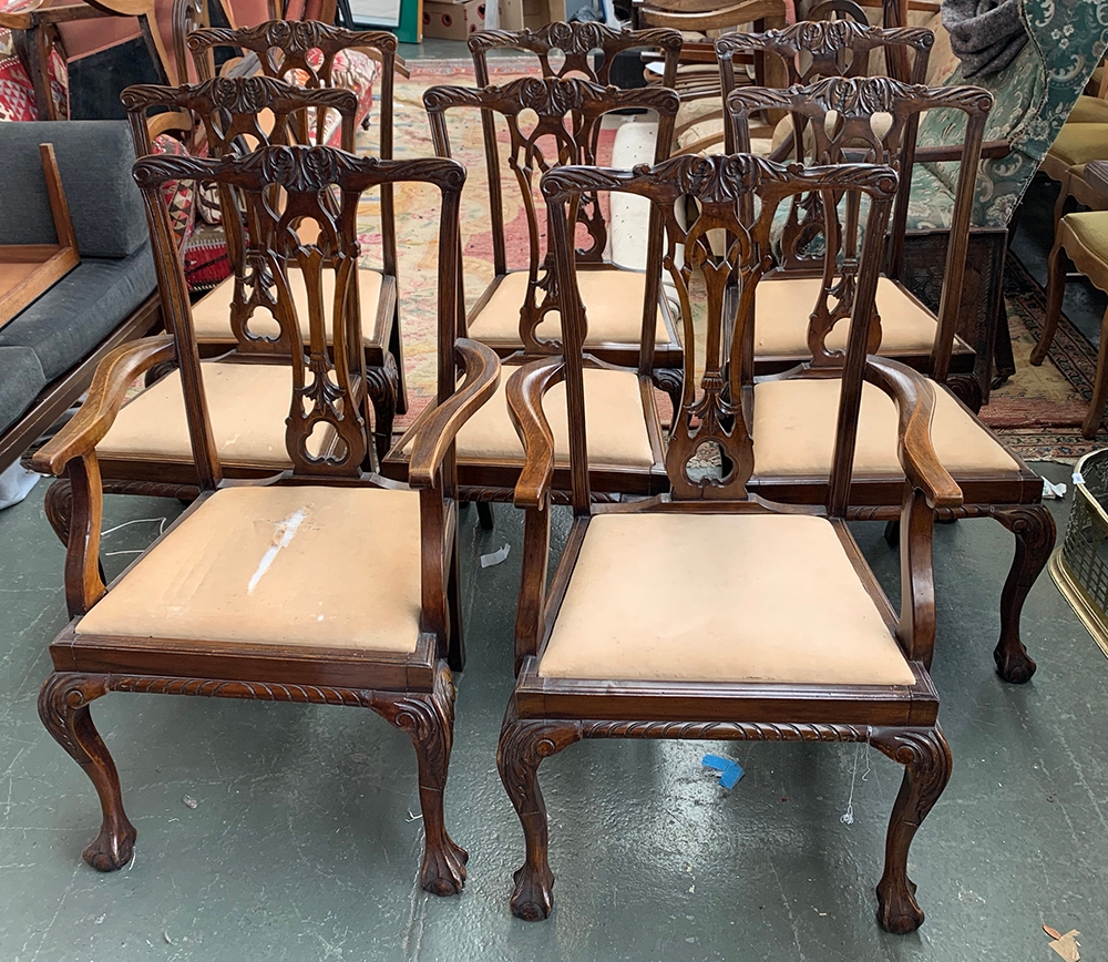 A set of eight Georgian style splat back dining chairs with drop in seats, two carvers